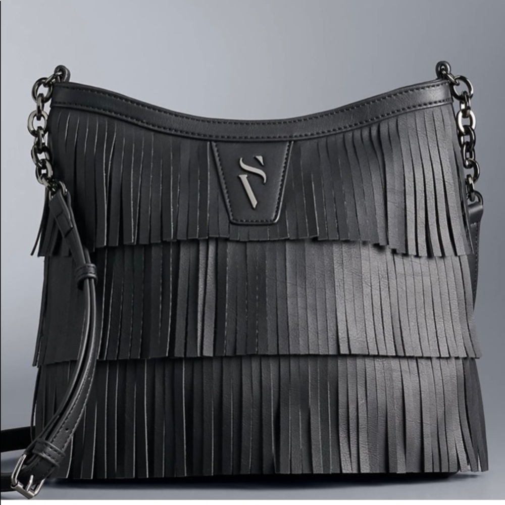 I have a black one and a beige colored one Vera Wang crossbody purse per purse